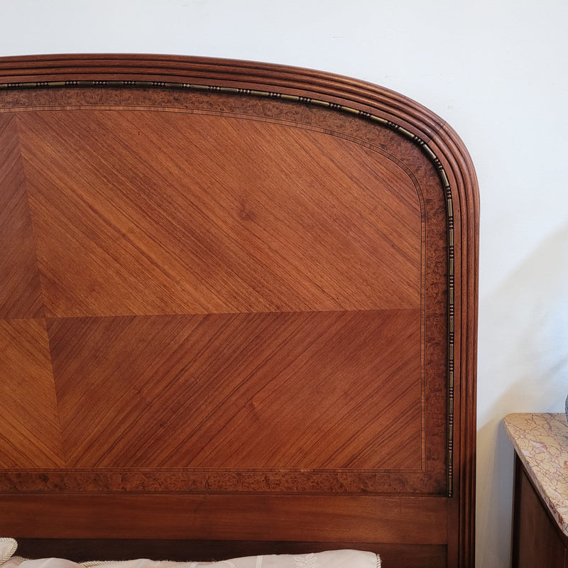This elegant French Art Deco Walnut & Burr Walnut queen-size bed showcases stunning bronze mounts and impeccable craftsmanship. Its custom-made slats ensure a comfortable and supportive rest, while the ease of assembly and disassembly adds to its practicality. Sourced directly from France, it has been detailed and is in good condition.