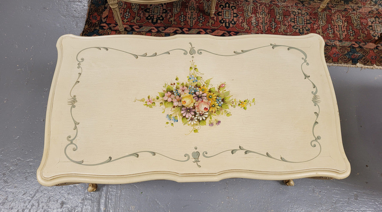 Delightful Vintage French Louis 15th style coffee table with original painted floral centerpiece and gilded highlights. It has been sourced from France and are in good original condition.