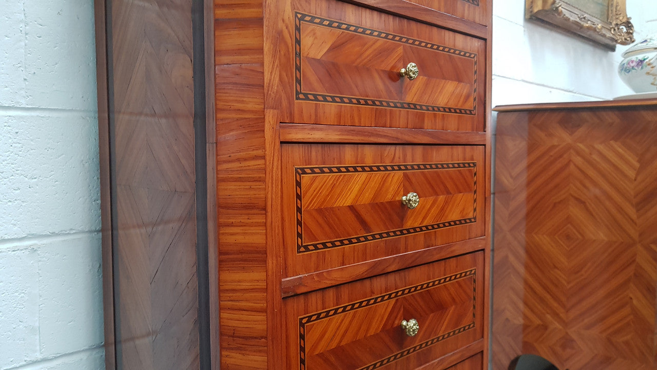 Louis XVI style French Kingwood and Rosewood inlaid semainier with a beautiful and practical marble top. Plenty of storage space with seven drawers. Also features elegant gilt mounts and decorative inlay. It has been sourced from France and is in good original detailed condition.