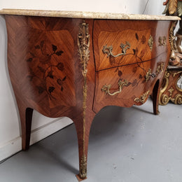 Louis XV style marquetry inlay marble top two drawer commode. It has decorative ormolu mounts and beautiful marble top. In good original detailed condition and has been sourced from France.