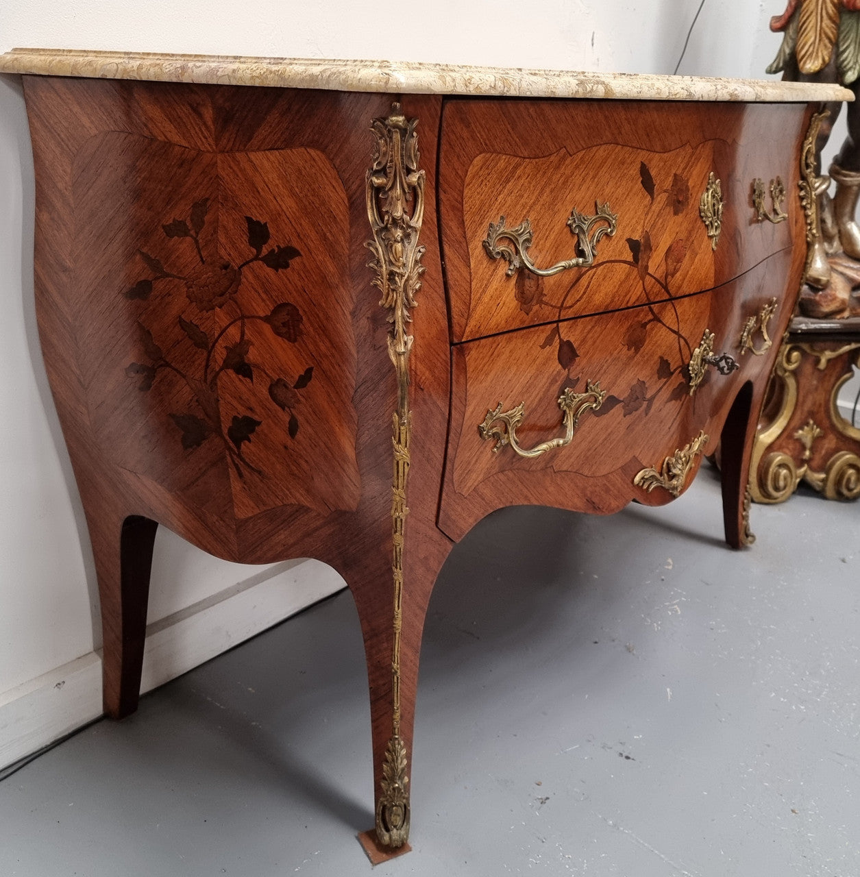 Louis XV style marquetry inlay marble top two drawer commode. It has decorative ormolu mounts and beautiful marble top. In good original detailed condition and has been sourced from France.