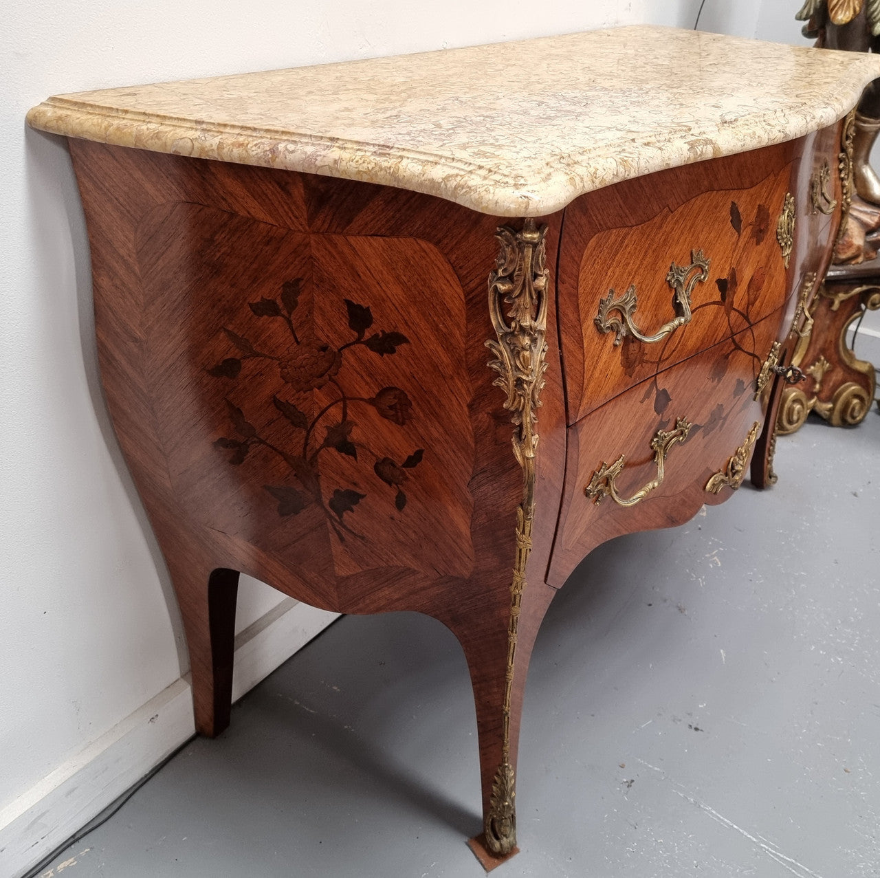 Louis XV style marquetry inlay marble top two drawer commode. It has decorative ormolu mounts and beautiful marble top. In good original detailed condition and has been sourced from France.