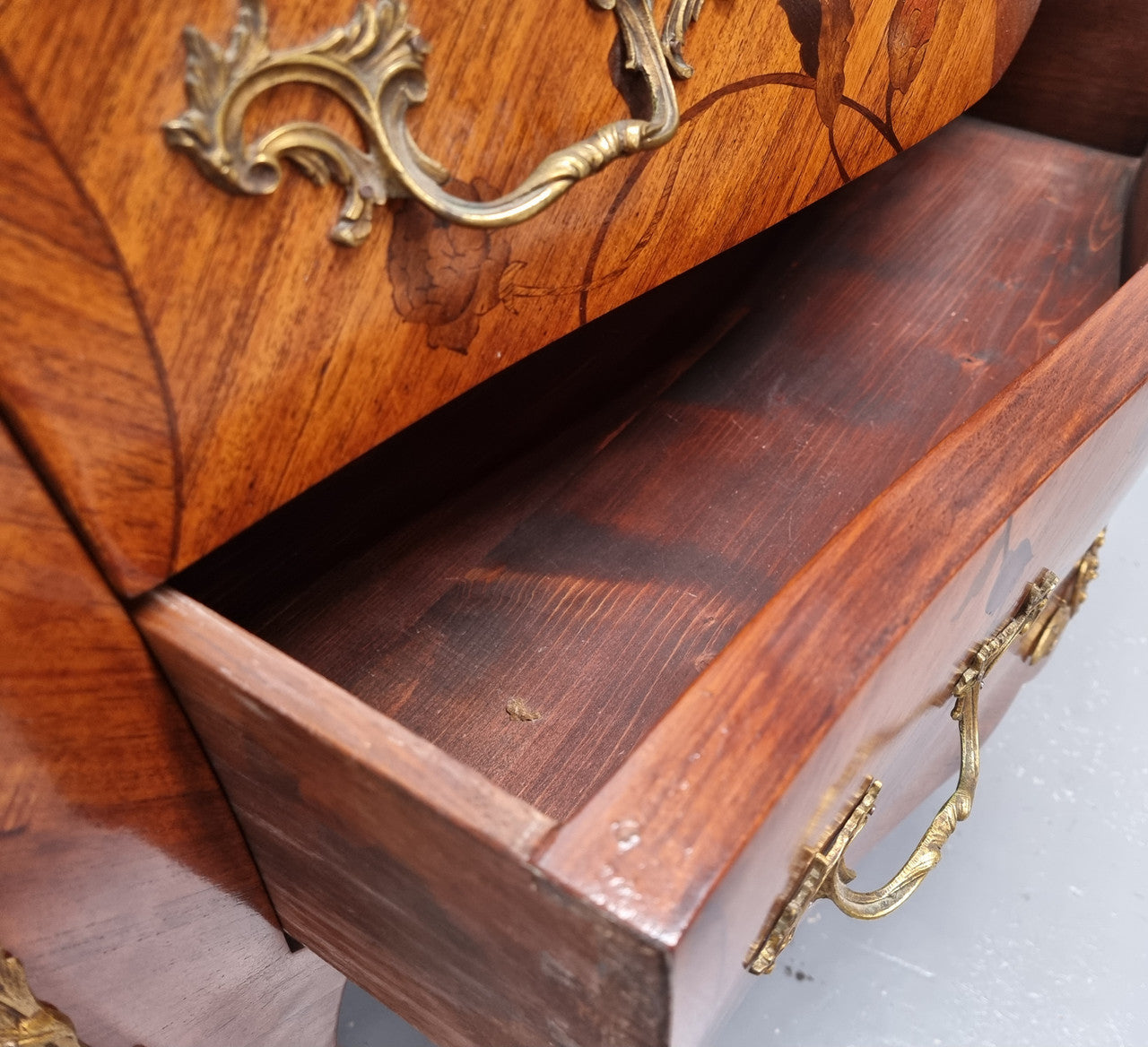 Louis XV style marquetry inlay marble top two drawer commode. It has decorative ormolu mounts and beautiful marble top. In good original detailed condition and has been sourced from France.