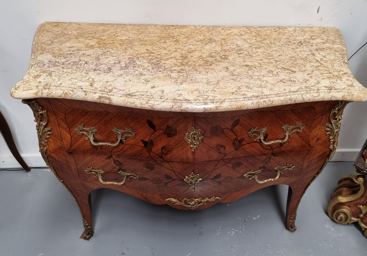 Louis XV style marquetry inlay marble top two drawer commode. It has decorative ormolu mounts and beautiful marble top. In good original detailed condition and has been sourced from France.