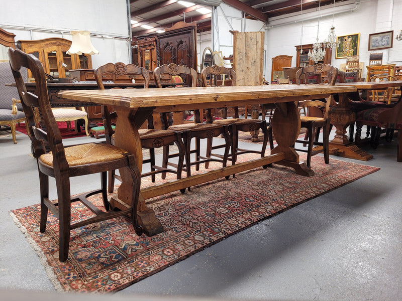 French parquetry top Fruitwood dining table with loads of character and comfortably fits eight people. It has been sourced from France and is in good original detailed condition.