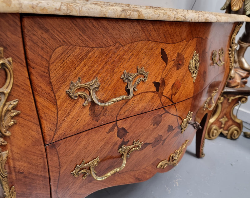 Louis XV style marquetry inlay marble top two drawer commode. It has decorative ormolu mounts and beautiful marble top. In good original detailed condition and has been sourced from France.