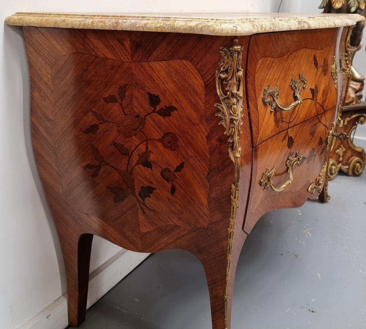 Louis XV style marquetry inlay marble top two drawer commode. It has decorative ormolu mounts and beautiful marble top. In good original detailed condition and has been sourced from France.