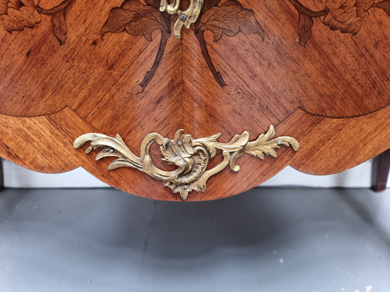 Louis XV style marquetry inlay marble top two drawer commode. It has decorative ormolu mounts and beautiful marble top. In good original detailed condition and has been sourced from France.