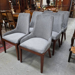 Quality modern grey upholstered dining chairs, angled view