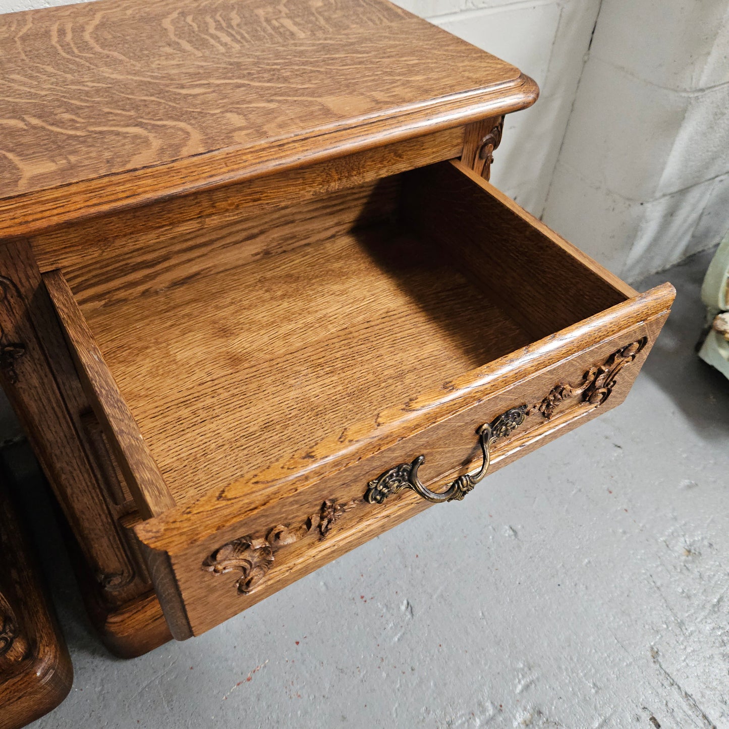 Hard to find Louis XVI style French Oak bedsides with three drawers and lovely carvings. They are in good original detailed condition. 