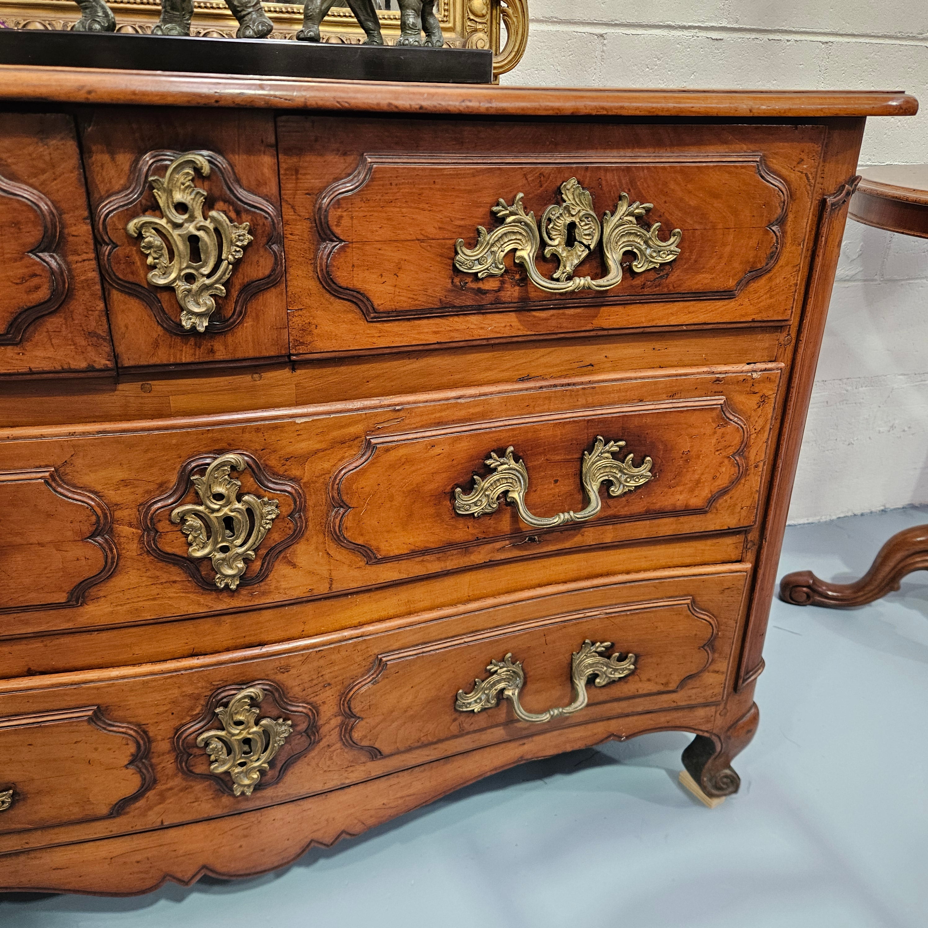 Fruitwood commode — right drawer fronts and curved apron