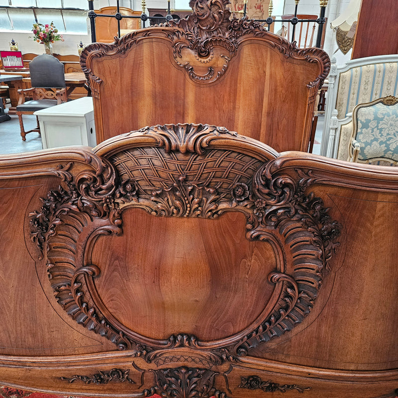 Beautifully carved Antique Louis XV style French Walnut queen size bed. Comes with custom made bed slates. Sourced from France and in good original detailed condition.