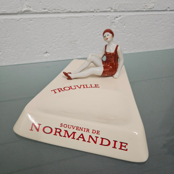 Unusual vintage female figure on large ceramic base. Souvenir Trouville De Normandie. Circa: 1950's.&nbsp; Could be used for keys, change or decoration. In good original condition.