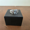 Front view of sterling silver Celtic knot ring with marquise-shaped blue stone