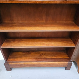 Australian blackwood Arts and Crafts bookcase with two fully adjustable shelves. It has been sourced locally. Made with solid Australian blackwood, this Arts and Crafts bookcase boasts two fully adjustable shelves for versatile storage options. Its good original detail adds a touch of character and charm. 