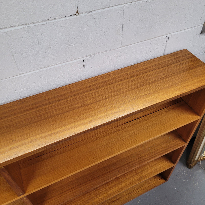 Australian Vic Ash double open bookcase with eight fixed shelves of pleasing narrow proportions. Sourced locally and in good original condition. Please view photos as they help form part of the description and condition.