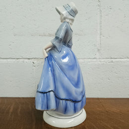 German Porcelain Figurine of a Lady in Blue Dress