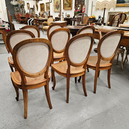 Stunning set of eight French Louis XV style walnut cane seat with upholstered back and ormolu mounts on the legs. Circa 1900. They are in excellent original condition and very comfortable. Please see photos as they form part of the description and condition.