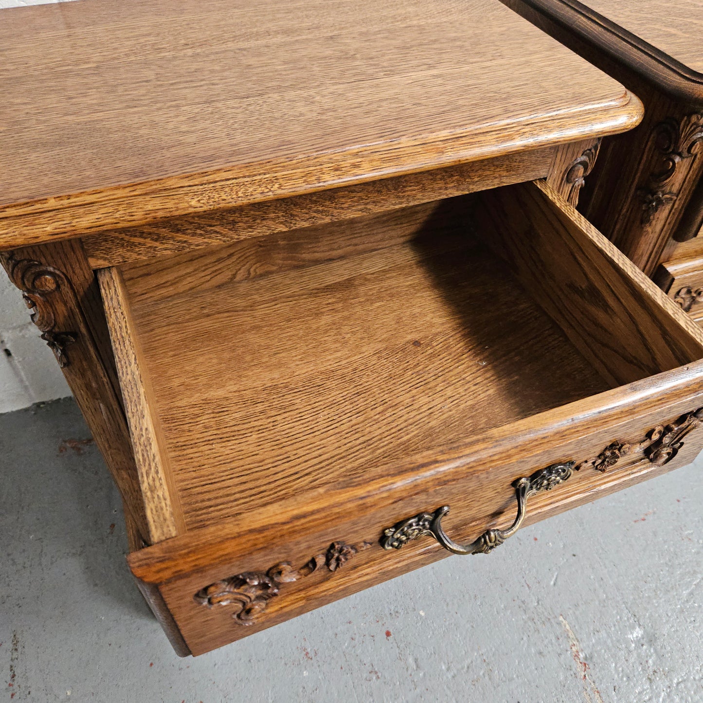 Hard to find Louis XVI style French Oak bedsides with three drawers and lovely carvings. They are in good original detailed condition. 