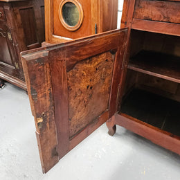 Stunning early 19th Century Elm buffet featuring two highly figured elm doors and drawers, it provides ample storage and is in good original condition.