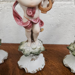 Set of Three Capodimonte Angle Figurines