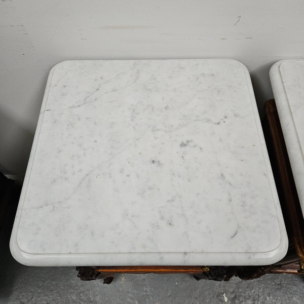 Pair of French Walnut Louis XV Style white marble top bedside cabinets. Featuring beautiful parquetry work and decorative carvings throughout. Sourced directly from France and in good original detailed condition.