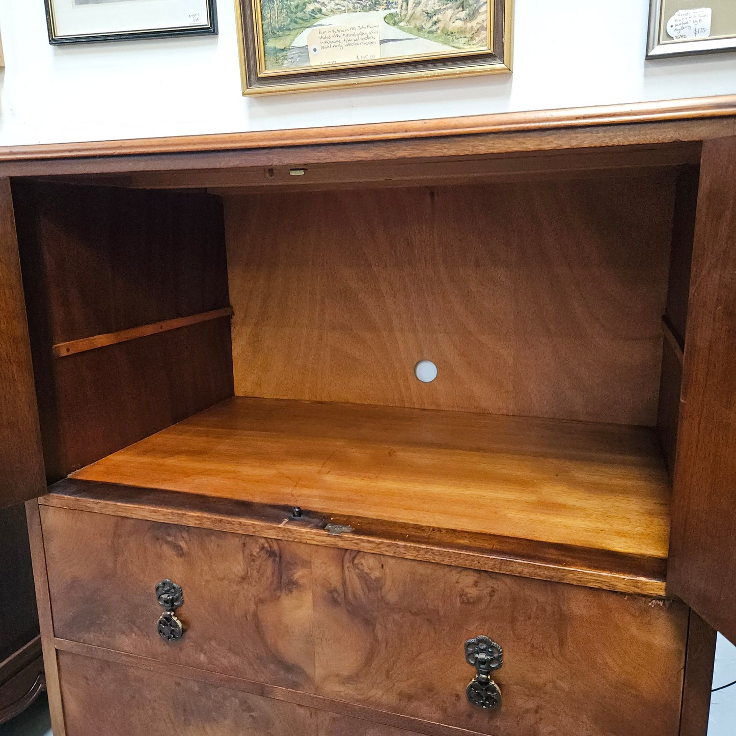 Lovely figured walnut Antique cabinet with a two door cabinet and two drawers. Circa 1930s. This cabinet can be used as a regular cabinet, drinks cabinet or tv unit as it has the hole for cables at the back. It is in good original detailed condition. 