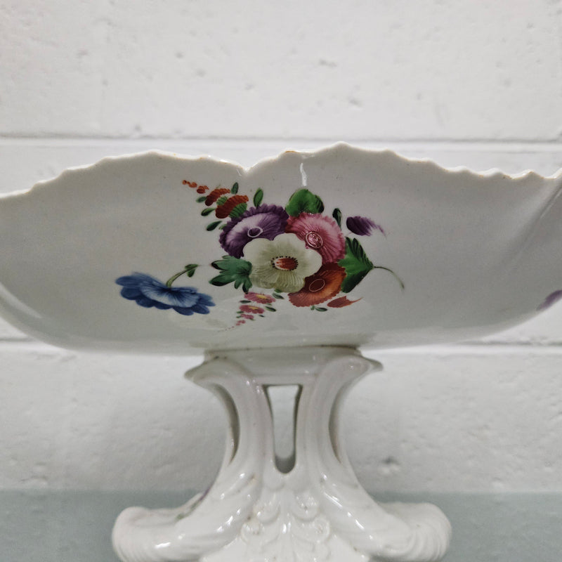 Lovely antique Coalport comport with a floral design 1830's , it is in good original condition with some faults under the bowl during the making. 