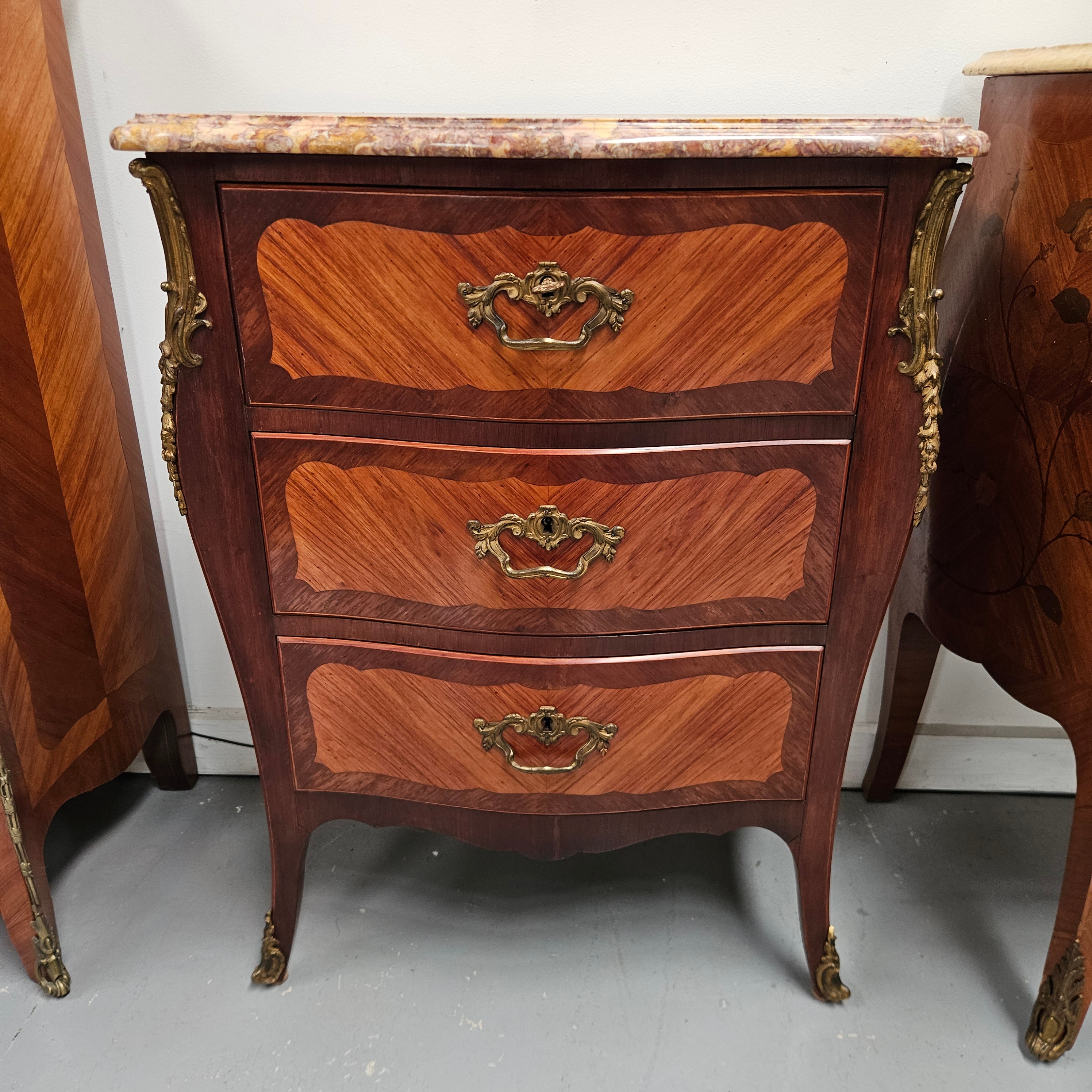 Attractive Louis XVth Style Marble Top Commode of Medium Proportions.