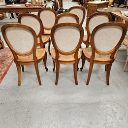 Stunning set of eight French Louis XV style walnut cane seat with upholstered back and ormolu mounts on the legs. Circa 1900. They are in excellent original condition and very comfortable. Please see photos as they form part of the description and condition.