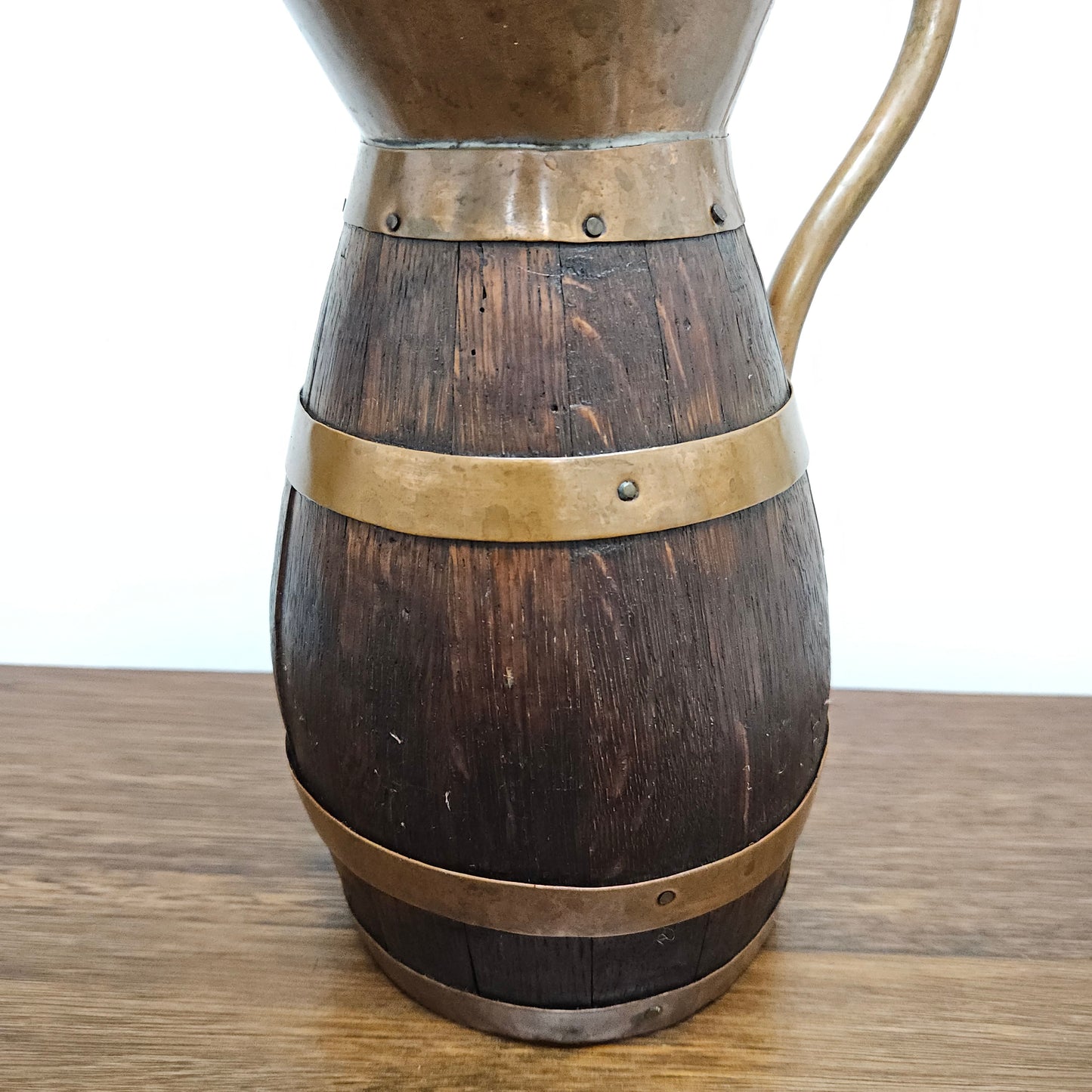 Antique miniature copper and French Oak jug. Hard to find and has been sourced directly from France. In good original detailed condition.