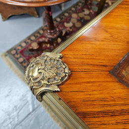 An exceptional French 19th Century Louis XV style "Bureau Plat" tooled leather top desk. Made from kingwood and rosewood, It has superb gilt cast ormolu mounts all the way around which means it can be used floating in the center of a room. In very good restored condition.