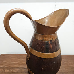Antique miniature copper and French Oak jug. Hard to find and has been sourced directly from France. In good original detailed condition.