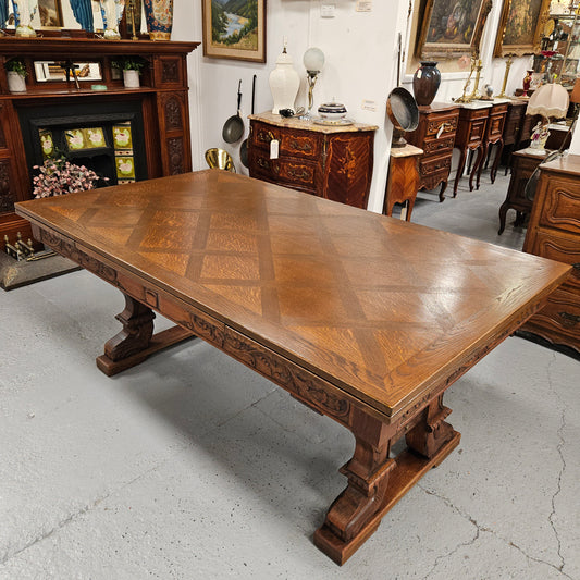 Beautiful French Oak Spanish style extension dining table with a decorative iron base and parquetry top. Lovely carvings on the legs and the skirt of the base.&nbsp; With the extensions closed it is 179.5 cm long and when fully extended it is 279 cm long. It has been sourced from France and in good original condition.