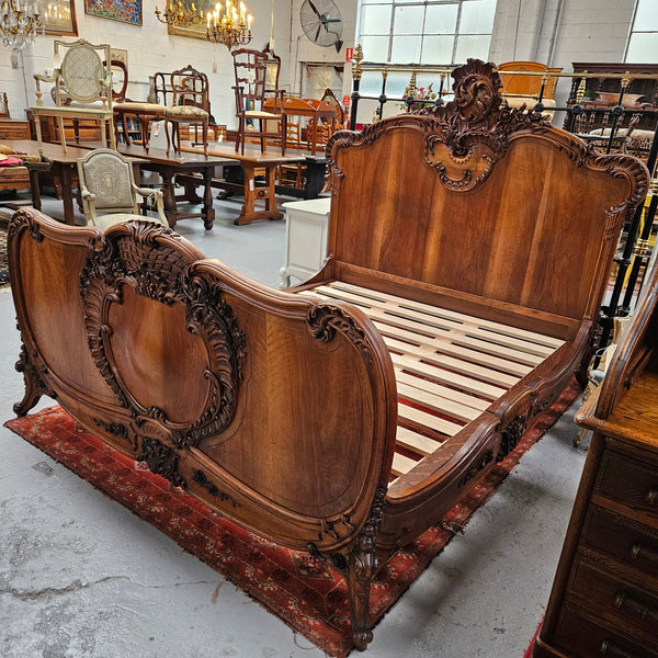 Beautifully carved Antique Louis XV style French Walnut queen size bed. Comes with custom made bed slates. Sourced from France and in good original detailed condition.