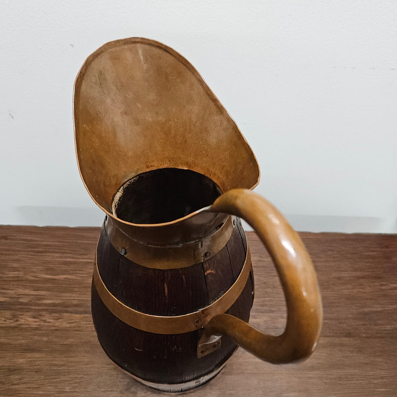 Antique miniature copper and French Oak jug. Hard to find and has been sourced directly from France. In good original detailed condition.