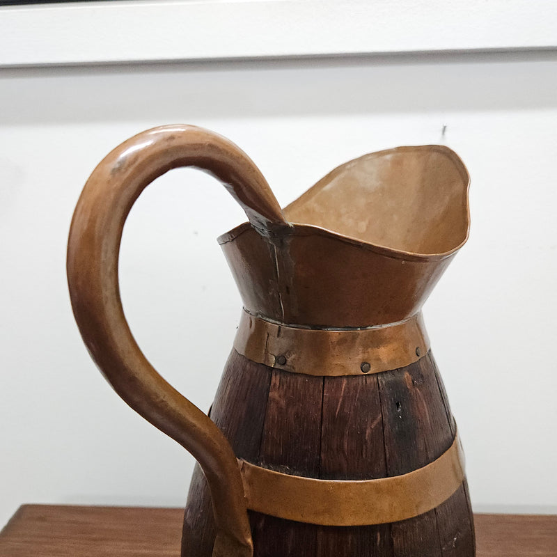 Antique miniature copper and French Oak jug. Hard to find and has been sourced directly from France. In good original detailed condition.