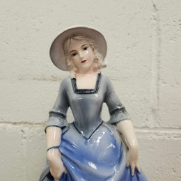 German Porcelain Figurine of a Lady in Blue Dress