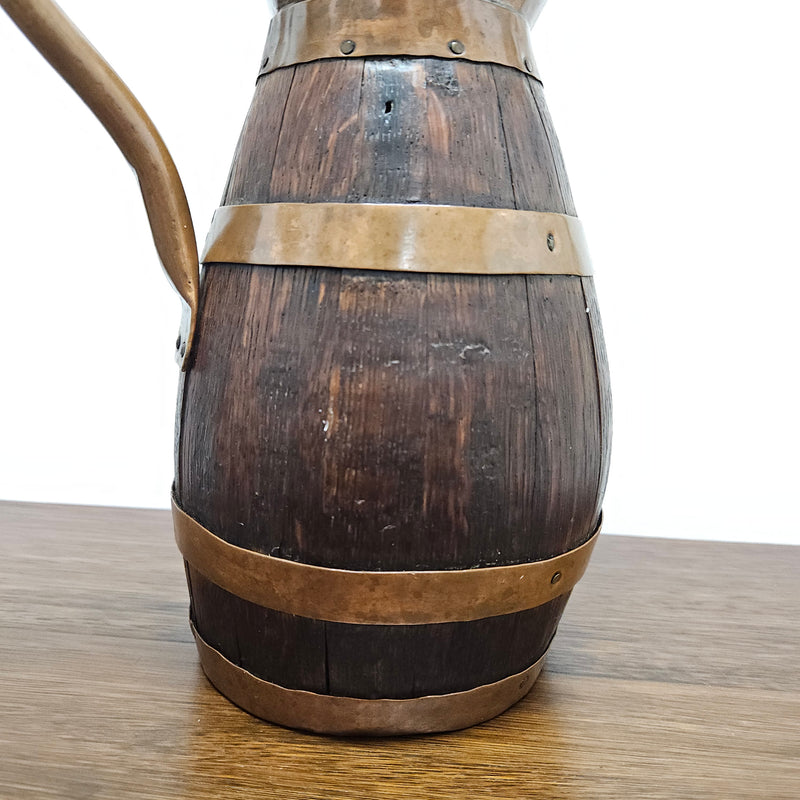 Antique miniature copper and French Oak jug. Hard to find and has been sourced directly from France. In good original detailed condition.