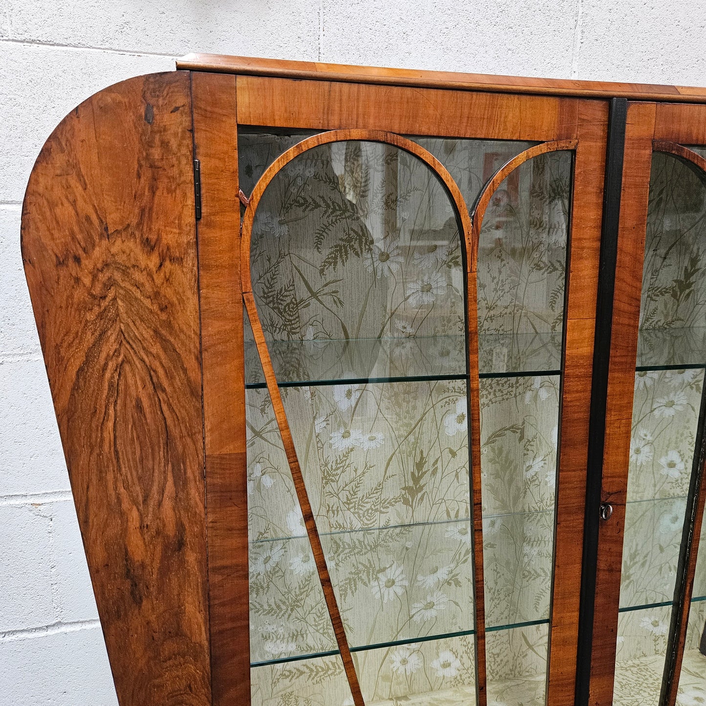 Stunning Art Deco display cabinet with two glass shelfs, Walnut and lockable glass doors. This cabinet is in great original condition for the age.