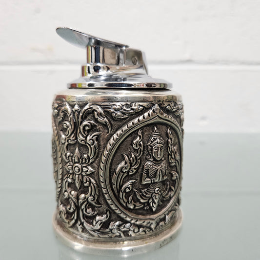 Vintage Siam sterling silver cigarette or small cigar holder and silver cased Ronson lighter. The holder in timber lined and both feature superb repousse worked decoration. The lighter hasn't been tested but it is in good original condition. Please view photos the as they help form part of the description and the condition.   Please note the measurements are for the cigarette holder.  Cigarette Holder: 170gm Lighter: 238gm