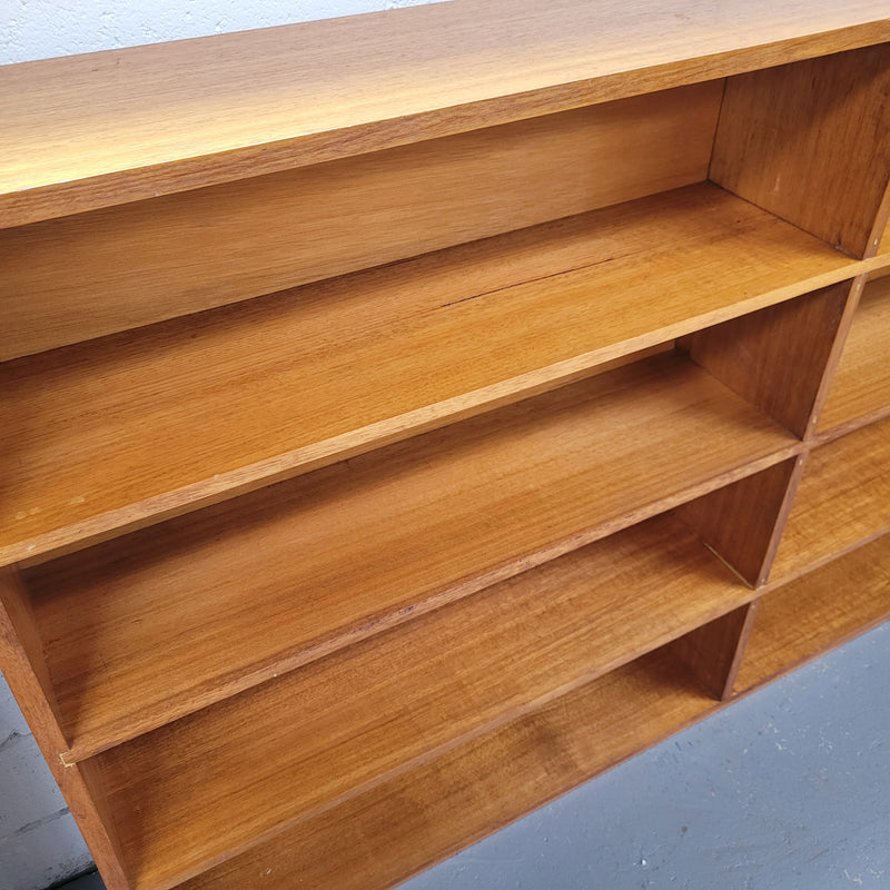 Australian Vic Ash double open bookcase with eight fixed shelves of pleasing narrow proportions. Sourced locally and in good original condition. Please view photos as they help form part of the description and condition.