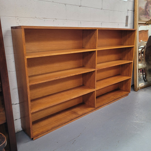 Australian Vic Ash double open bookcase with eight fixed shelves of pleasing narrow proportions. Sourced locally and in good original condition. Please view photos as they help form part of the description and condition.