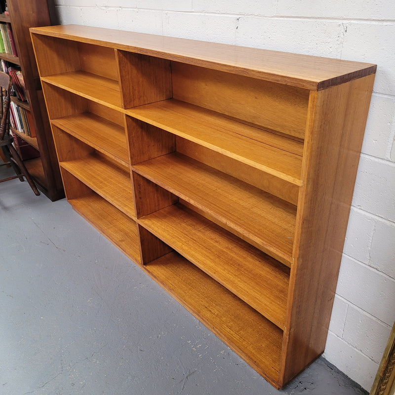 Australian Vic Ash double open bookcase with eight fixed shelves of pleasing narrow proportions. Sourced locally and in good original condition. Please view photos as they help form part of the description and condition.