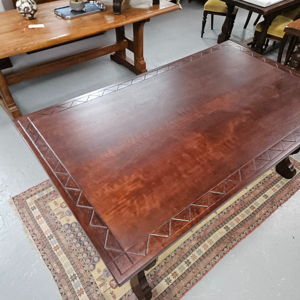 Vintage walnut Spanish style farmhouse table with a beautiful top and iron work. It is in good restored condition. Circa 1950'S.