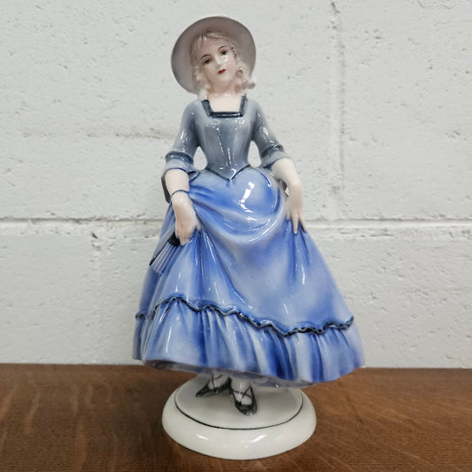 German Porcelain Figurine of a Lady in Blue Dress