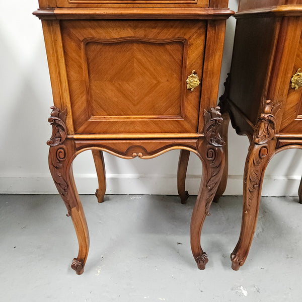 Pair of French Walnut Louis XV Style white marble top bedside cabinets. Featuring beautiful parquetry work and decorative carvings throughout. Sourced directly from France and in good original detailed condition.