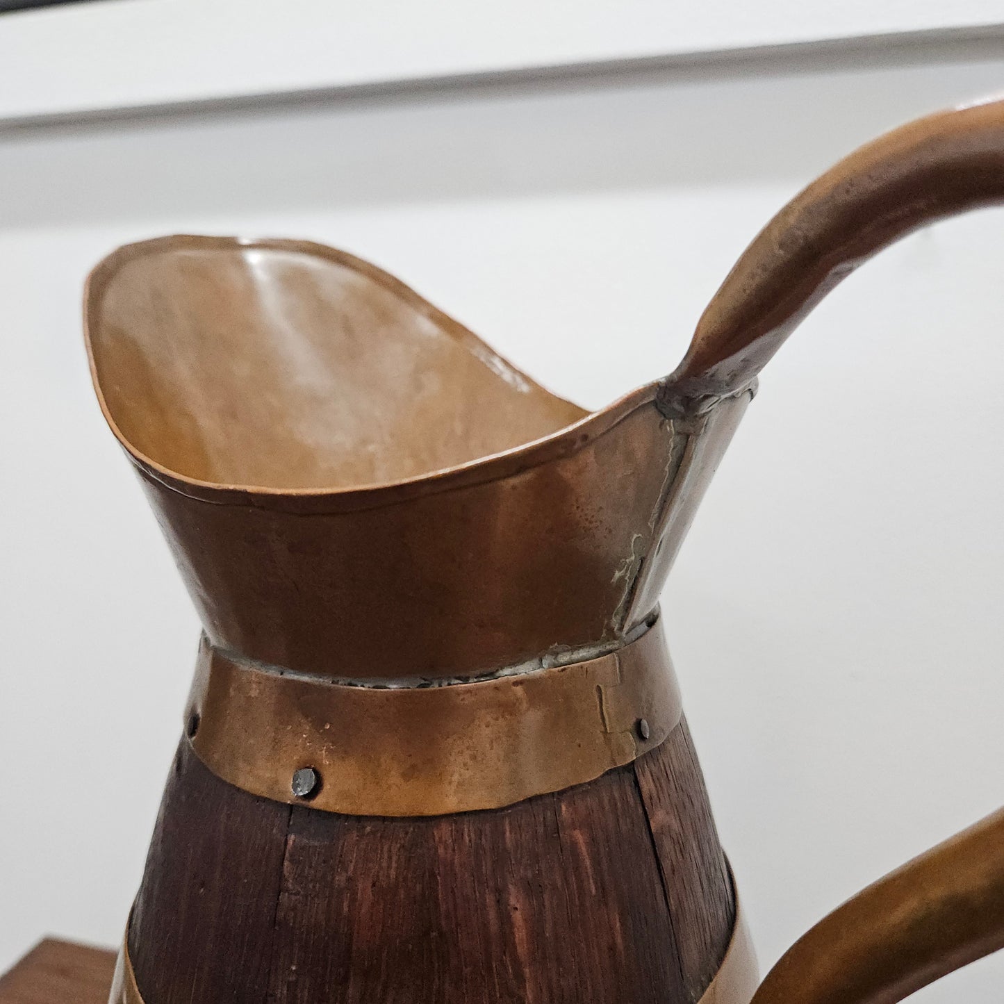 Antique miniature copper and French Oak jug. Hard to find and has been sourced directly from France. In good original detailed condition.