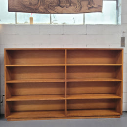 Australian Vic Ash double open bookcase with eight fixed shelves of pleasing narrow proportions. Sourced locally and in good original condition. Please view photos as they help form part of the description and condition.