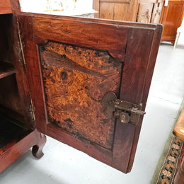 Stunning early 19th Century Elm buffet featuring two highly figured elm doors and drawers, it provides ample storage and is in good original condition.